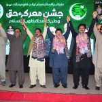 State Minister for Religious AffairS, Kheal Das Kohistani, senior vice president sindh PML (N) shah Muhammad shah and spokesperson of federal government raja ansari hands in hand standing on the stage during marka-e-haq celebration program organized by PML (N) at local hotel