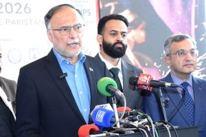 Federal Minister for Planning and Development Ahsan Iqbal talks to media persons during his visit to exhibition stalls at the Expo Centre