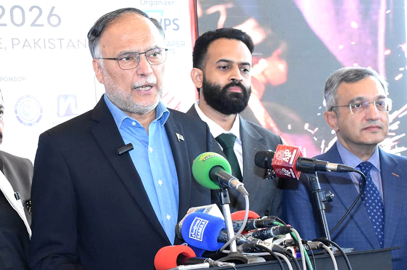 Federal Minister for Planning and Development Ahsan Iqbal talks to media persons during his visit to exhibition stalls at the Expo Centre