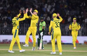 Australian national team players celebrate the wicket of Pakistan’s Sahibzada Farhan during the first One Day International (ODI) between Pakistan national cricket team and Australia national cricket team at the Rawalpindi Cricket Stadium