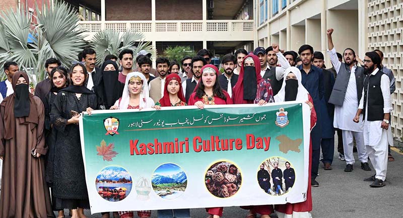 Students participate in a walk organized by the Jammu Kashmir Students Council Punjab University in connection with Kashmir Cultural Day outside Faisal Auditorium at Punjab University