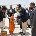 A girl in traditional costume presents a bouquet to Pakistan People’s Party Chairman Bilawal Bhutto Zardari as Chief Minister Balochistan Mir Sarfraz Ahmed Bugti receives his on his arrival