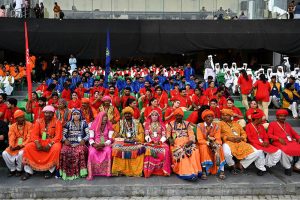 Artist seated in the stadium ahead of their performing during the Pakistan Super League (PSL) closing ceremony before final match between Hyderabad Kingsmen and Peshawar Zalmi at Gaddafi Stadium