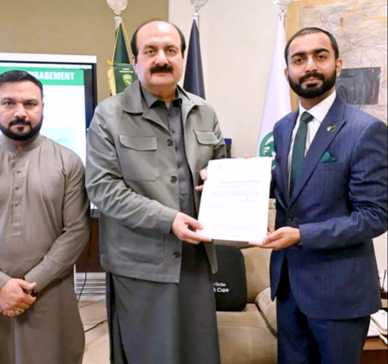 Chairman of the Prime Minister's Youth Programme, Rana Mashhood Ahmad Khan, presenting the notification to Muhammad Rauf Raja as Focal Person Chairman PMYP for Tourism and Hospitality