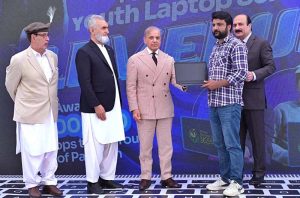Prime Minister Muhammad Shehbaz Sharif distributes laptops among the beneficiaries from GB under PM's Youth Laptop Scheme.