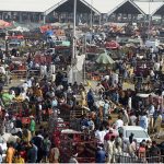A large number of People selecting and purchasing the sacrificial animals to the Livestock vendors at temporary cattle market Shahpur Kanjra ahead of Eidul Azha