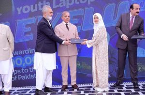 Prime Minister Muhammad Shehbaz Sharif distributes laptops among the beneficiaries from GB under PM's Youth Laptop Scheme.
