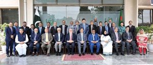Chairman Senate, Syed Yousaf Raza Gilani, presents a certificate to a participant during the closing ceremony of the Pakistan-Bangladesh Knowledge Corridor, Executive Training Programme for senior civil servants from Bangladesh at the National Institute Of Public Administration (NIPA).