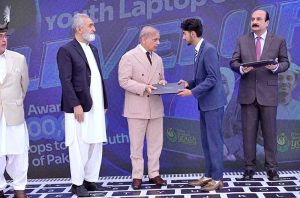 Prime Minister Muhammad Shehbaz Sharif distributes laptops among the beneficiaries from GB under PM's Youth Laptop Scheme.