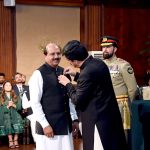 Punjab Governor Sardar Saleem Haider awards the Hilal-e-Imtiaz to Lahore Press Club President Arshad Ansari at Governor House