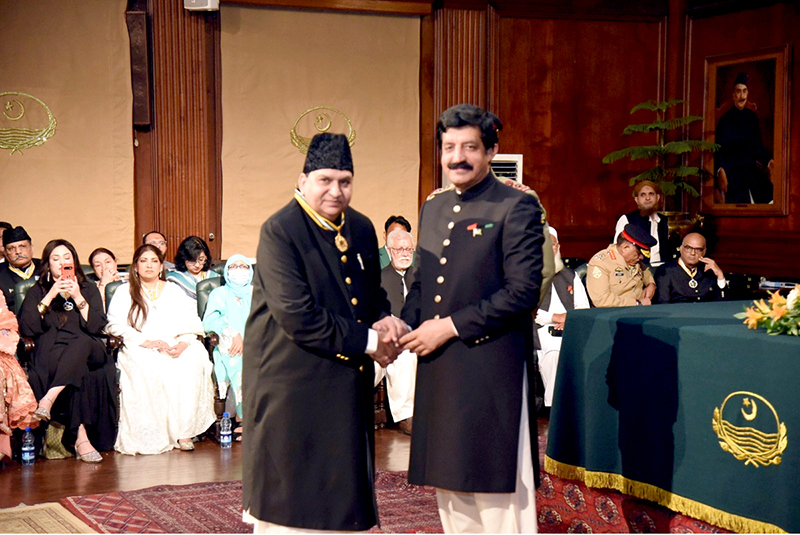 Punjab Governor Sardar Saleem Haider awards the Hilal-e-Imtiaz to S M Sadiq at Governor House