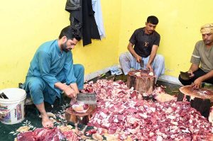 Butchers are slaughtering sacrificial animal on the first day of Eidul Azha