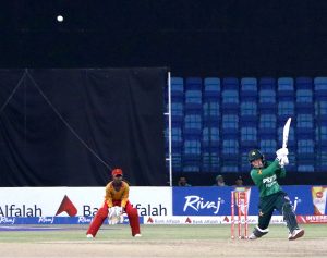 Pakistan Women's Player, Fatima Sana plays a shot during the Women's Cricket 1st T-20 match between Pakistan and Zimbabwe in National Stadium