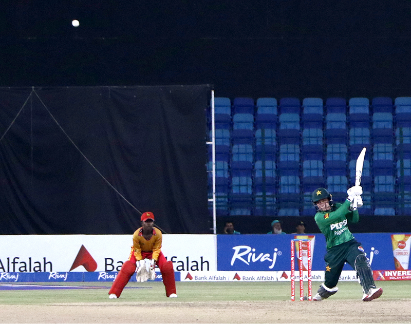 Pakistan Women's Player, Fatima Sana plays a shot during the Women's Cricket 1st T-20 match between Pakistan and Zimbabwe in National Stadium