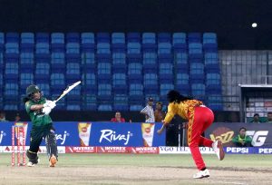 Pakistan Women's Player, Fatima Sana plays a shot during the Women's Cricket 1st T-20 match between Pakistan and Zimbabwe in National Stadium