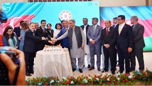 Chairman Senate Syed Yousaf Raza Gilani cutting cake along with dignitaries on occasion of Independence Day of Azerbaijan during a ceremony