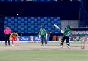 Pakistan Women's Player, Fatima Sana plays a shot during the Women's Cricket 1st T-20 match between Pakistan and Zimbabwe in National Stadium