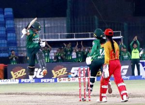 Pakistan Women's Player, Fatima Sana plays a shot during the Women's Cricket 1st T-20 match between Pakistan and Zimbabwe in National Stadium