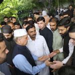 Prime Minister Muhammad Shehbaz Sharif exchanging Eid greetings with people after offers Eidul Azha prayers