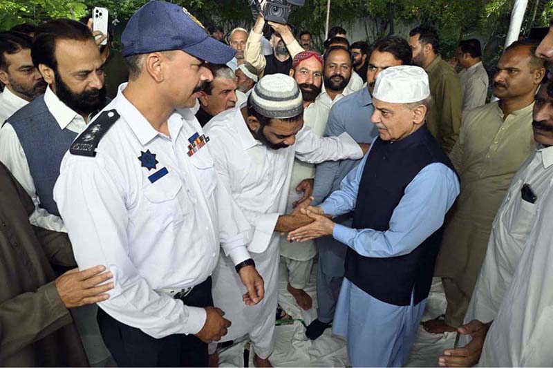 Prime Minister Muhammad Shehbaz Sharif exchanging Eid greetings with people after offers Eidul Azha prayers