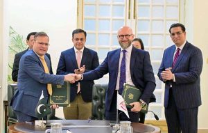 Federal Minister for Economic Affairs Ahad Cheema observing the loan signing ceremony between Pakistan and Asian Infrastructure Investment Bank held in the federal capital.