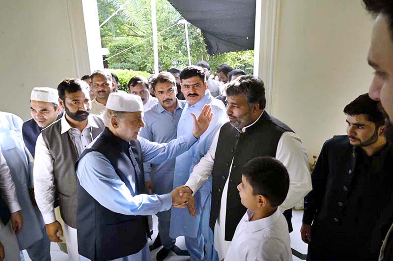 Prime Minister Muhammad Shehbaz Sharif exchanging Eid greetings with people after offers Eidul Azha prayers