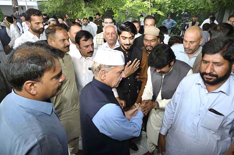 Prime Minister Muhammad Shehbaz Sharif exchanging Eid greetings with people after offers Eidul Azha prayers