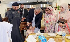 Federal Minister for Interior Mohsin Naqvi meets the families of police personnel martyred in Bannu during his visit to the Police Headquarters