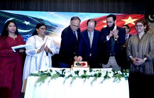 Federal Minister for Information and Broadcasting Attaullah Tarar, Minister for Planning, Development & Special Initiatives Ahsan Iqbal and Chinese Charge d’Affaires Mr. Shi Yuanqiang cut the cake during the Pakistan–China Cultural Evening at the Pakistan-China Friendship Center, marking 75 years of friendship, cultural harmony and strong bilateral ties.