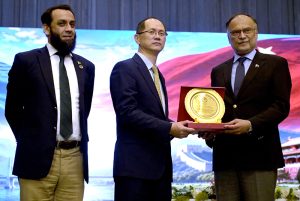 Minister for Planning, Development and Special Initiatives Ahsan Iqbal along with Federal Minister for Information and Broadcasting Attaullah Tarar presenting a shield of Pak-China friendship to Chinese Chargé d’Affaires Mr. Shi Yuanqiang during the Pakistan–China Cultural Evening at the Pakistan-China Friendship Center, marking 75 years of friendship, cultural harmony and strong bilateral ties.