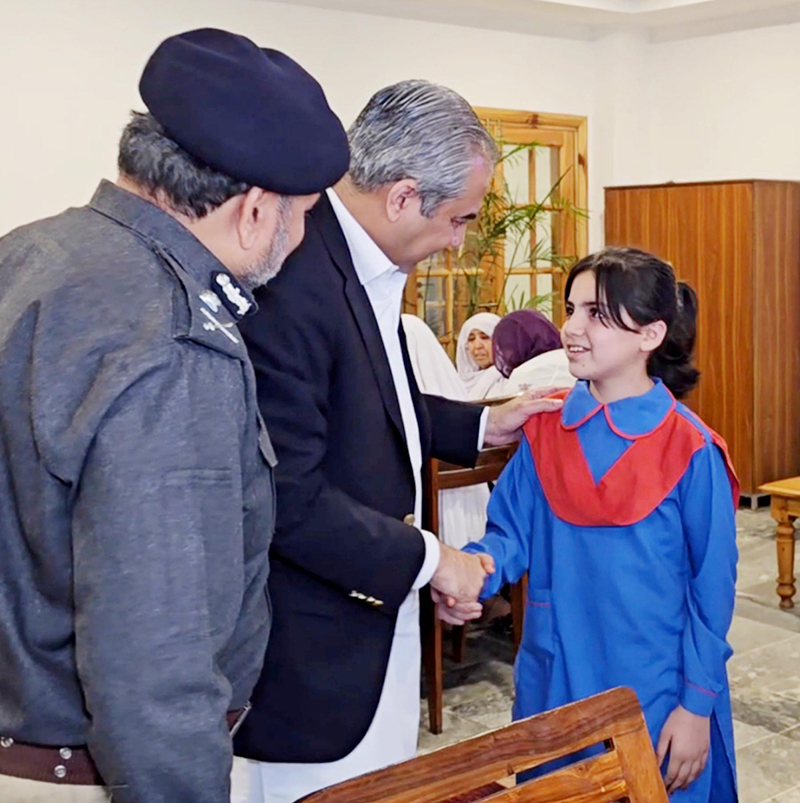 Federal Minister for Interior Mohsin Naqvi meets the families of police personnel martyred in Bannu during his visit to the Police Headquarters