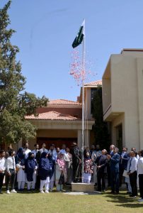 Seminar participants hoist national flag on the first anniversary of "Marka e Haq" organized by Balochistan Think Tank Network in Collaboration with BUITEMS .