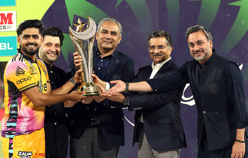 Peshawar Zalmi Captain Babar Azam receives the trophy from PCB Chairman Mohsin Naqvi after winning the Pakistan Super League (PSL 11) final match between Hyderabad Kingsmen and Peshawar Zalmi at Gaddafi Stadium