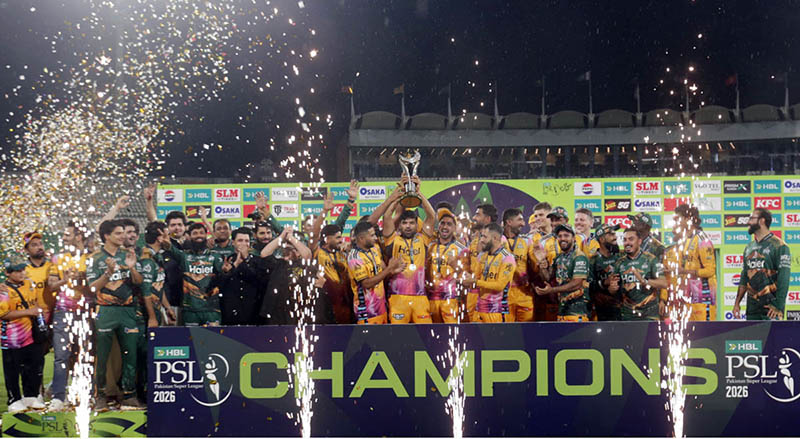 Peshawar Zalmi captain Babar Azam, along with teammates, celebrates with the trophy after winning the Pakistan Super League (PSL 11) final match against Hyderabad Kingsmen at Gaddafi Stadium