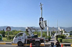 Workers are busy installing CCTV cameras in sector H-8 in Federal Capital.