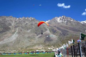 A view of paratrooper demonstrating his skills during the opening ceremony of the Shandur Polo Festival 2026 at the world’s highest polo ground