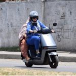 Women ride an electric scooter along Tipu Road in Rawalpindi, as more residents, particularly women, turn to affordable electric two-wheelers for daily commuting amid rising fuel costs