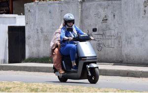 Women ride an electric scooter along Tipu Road in Rawalpindi, as more residents, particularly women, turn to affordable electric two-wheelers for daily commuting amid rising fuel costs