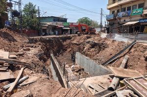 Workers and heavy machinery carry out construction work near Gunj Mandi, as the project progresses to ease traffic congestion and improve the city's road infrastructure