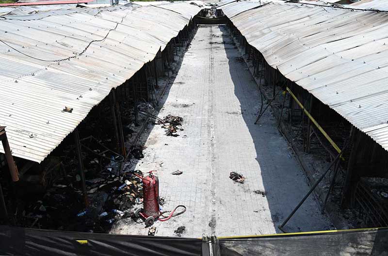 A devastating view of burnt and charred shops at H-9 Bazaar following a major fire incident that gutted scores of commercial stalls in the market a few days ago