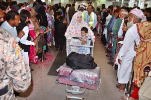 Pilgrims of first Hajj flight are being received by their relatives at Faisalabad International Airport on their returning from Saudi Arabia