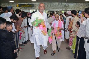 Pilgrims of first Hajj flight are being received by their relatives at Faisalabad International Airport on their returning from Saudi Arabia