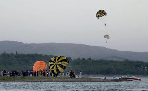 Tourists enjoying paragliding adventure at Khanpur Dam, one of the region’s leading outdoor recreation destinations.