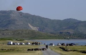 Tourists enjoying paragliding adventure at Khanpur Dam, one of the region’s leading outdoor recreation destinations.
