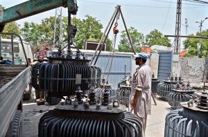 WAPDA staffers unload faulty transformers for repair at a WAPDA office, as efforts continue to restore the malfunctioning power equipment to ensure uninterrupted electricity supply.