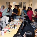 Chinese calligraphy artist Jiang Lin Zitong demonstrates the art of traditional Chinese calligraphy during a special workshop titled “Enduring Culture, Profound Friendship” at the Shakir Ali Museum, commemorating the 75th anniversary of diplomatic relations between Pakistan and China