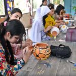 Students show their painting skills on pottery at a stall during the Summer School & Fiesta 2026 at Islamabad College for Girls, F-6/2