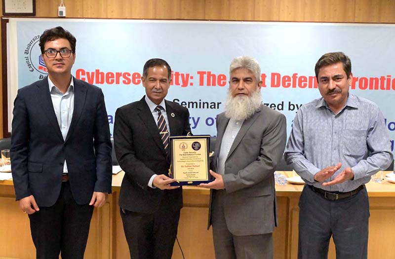 Vice Chancellor CUST Dr. Mansoor Ahmad presenting souvenir to Chief Guest Dr. Sultan Azam Temuri, former IGP Islamabad during a seminar “Cyber Security: The Next Defence Frontier” at Capital University of Science and Technology (CUST)