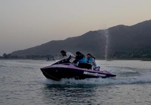 Tourists enjoying paragliding adventure at Khanpur Dam, one of the region’s leading outdoor recreation destinations.