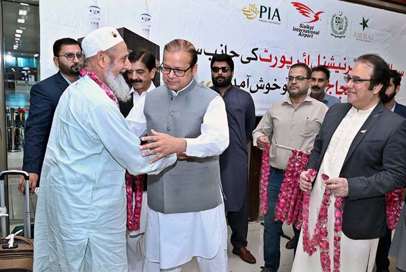 Minister of State for Development and Planning Chaudhry Armaghan Subhani, Chairman Sial Hassan Ali Bhatti welcomes the first and second flight pilgrims returning from Saudi Arabia at the Sialkot International Airport